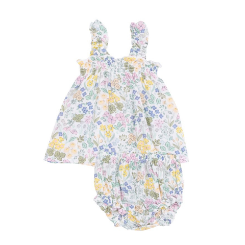 white shirt with pink, blue, yellow, and green floral. has ruffle straps and matching bloomers. 