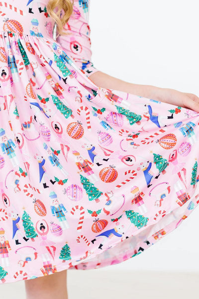 Girls’ twirl dress with ballet neckline and scoop back, made from soft, vibrant fabric—ideal for everyday wear and play.