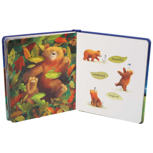 Open book with colorful illustrations of a bear and leaves on a white background