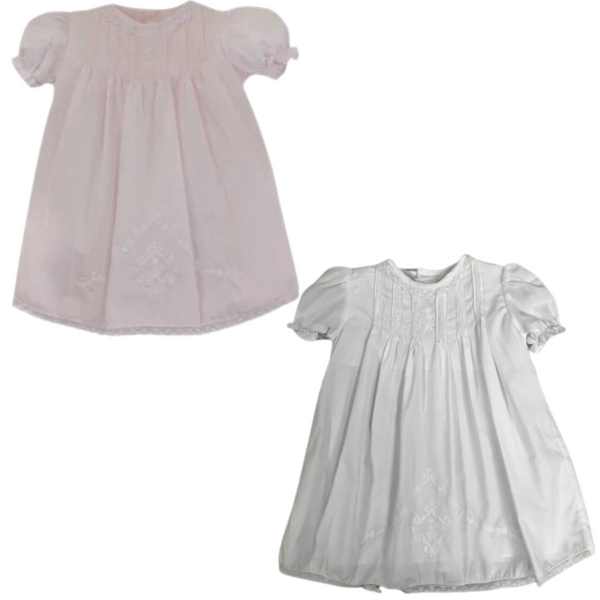 Pleated dress in pink and white with delicate hand embroidery and lace trim, perfect for special occasions.