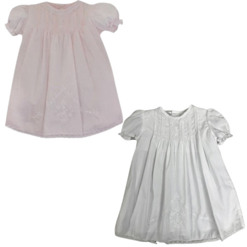 Pleated dress in pink and white with delicate hand embroidery and lace trim, perfect for special occasions.