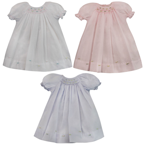 Smocked dress with roses on the hemline. 