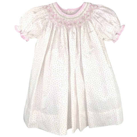 white dress with pink floral and pink and green smocking 