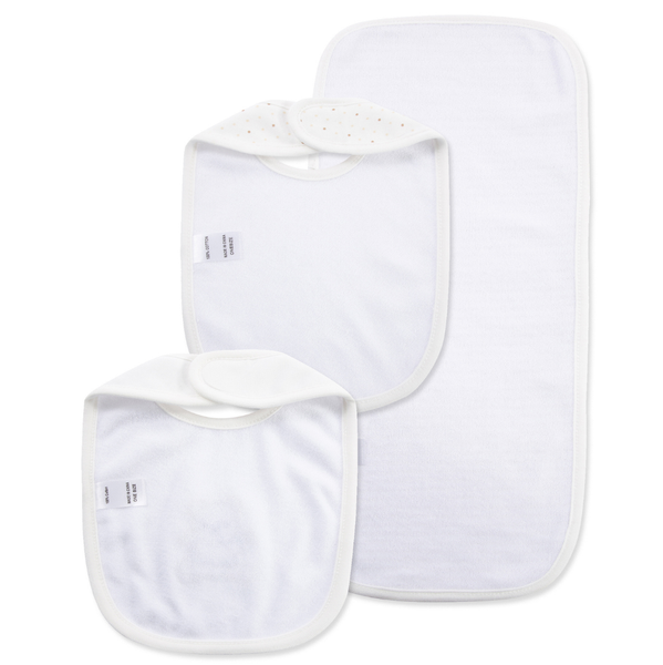 Back view of two baby bibs and matching burp cloth showing soft white absorbent backing, white trim, and secure hook-and-loop closures.