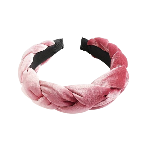 A soft pink, wide velvet headband with a prominent braided design, padded for comfort, against a white background.
