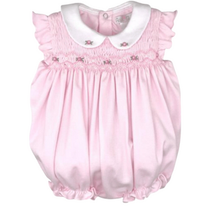 pink bubble with rose smocking at the top and a white rounded collar with two roses on it. 