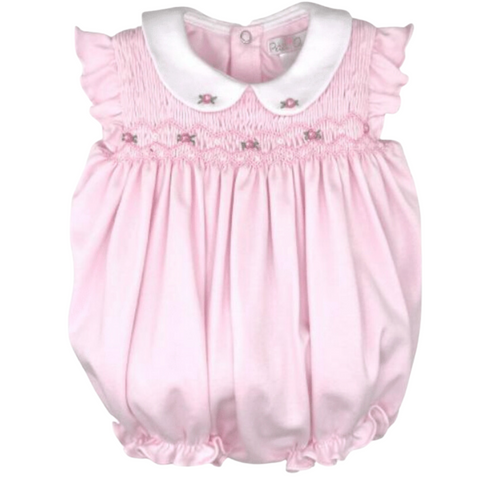 pink bubble with rose smocking at the top and a white rounded collar with two roses on it. 