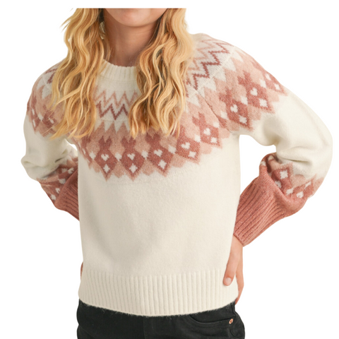 White sweater with a pink geometric pattern along the neckline. 