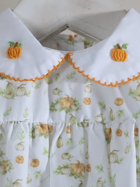 White collar with orange trim and two emborder pumpkins on collar