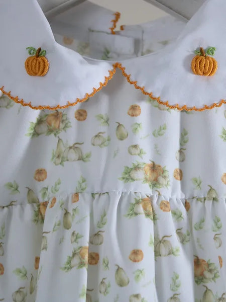 white collar with orange trim and two embroider pumpkinss