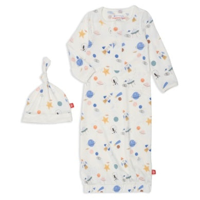 Gown and hat set with an outerspace background with spaceships, stars, and planets. 