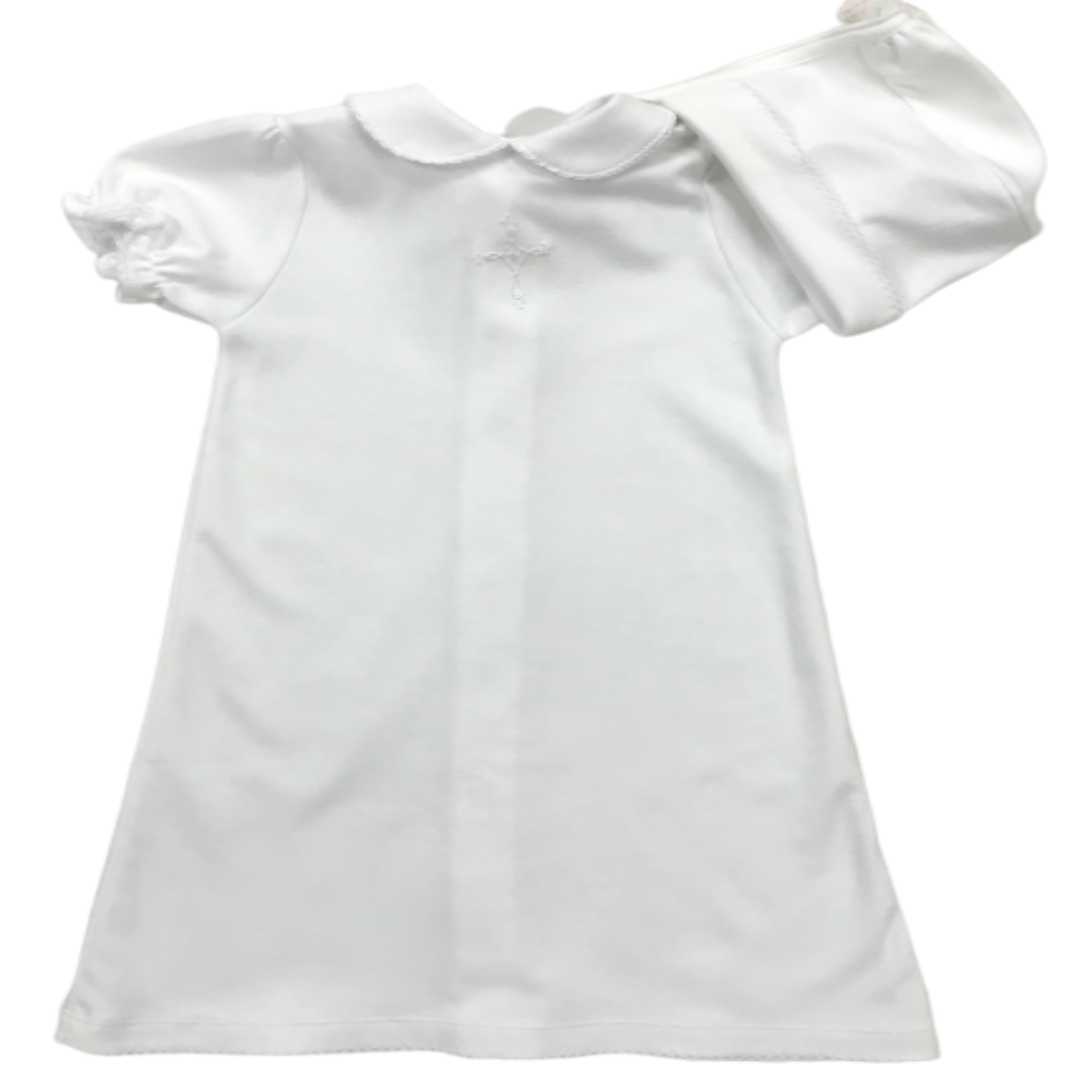 white daygown with knitted cross on the front and a rounded collar. has a matching bonnet. 