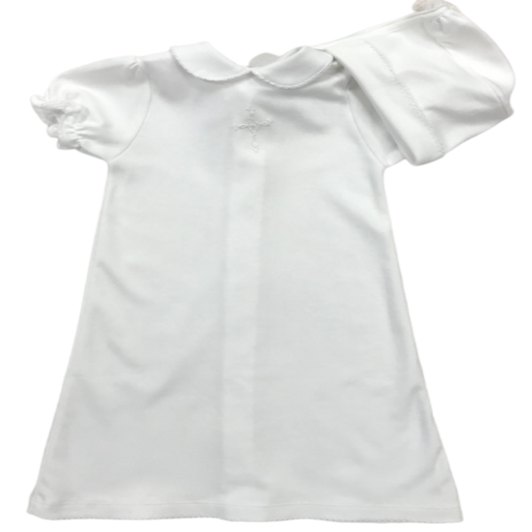 white daygown with knitted cross on the front and a rounded collar. has a matching bonnet. 